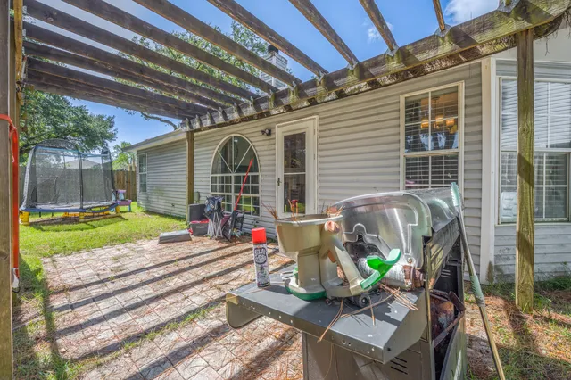 a view of a swimming pool with a patio