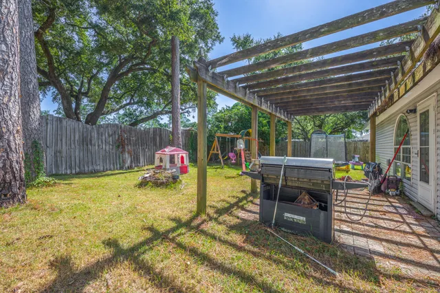a play ground with swimming pool in front of it
