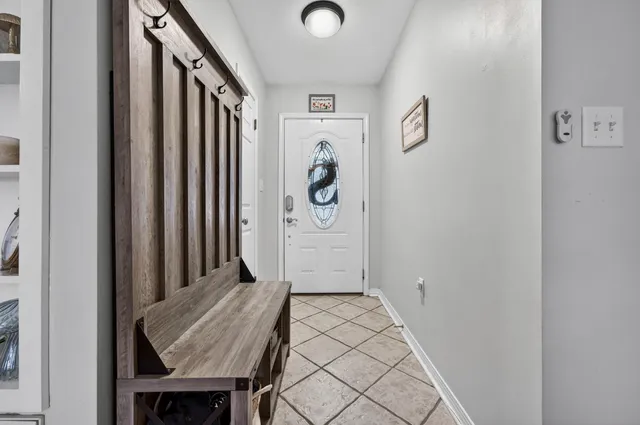 a view of an entryway with wooden floor