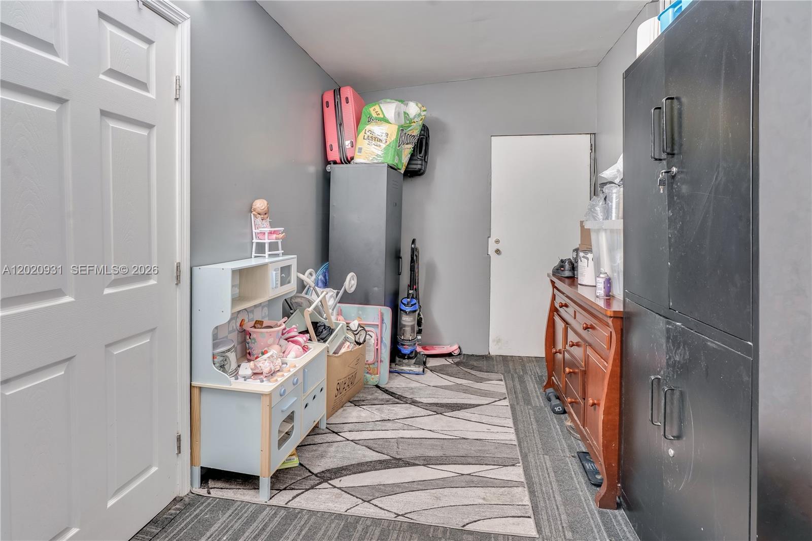 1360 Northwest 77th Street Miami, FL 33147 - Photo 25 of 41 a bedroom with a bed and a window