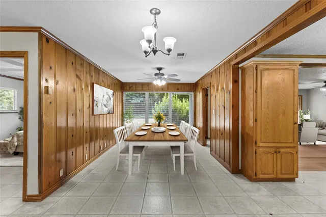 a outdoor space with patio couch and chandelier