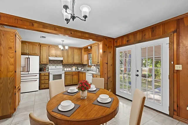 a kitchen with stainless steel appliances granite countertop a sink and refrigerator
