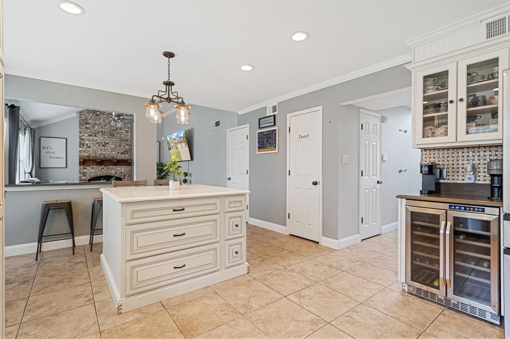 303 Hopewell Street Grand Prairie, TX 75052 - Photo 11 of 28 a bathroom with a double vanity sink a mirror and a shower