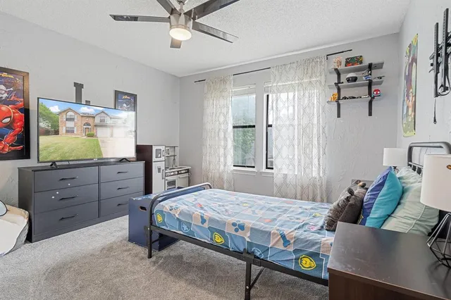 a view of a house with backyard sitting area and garden