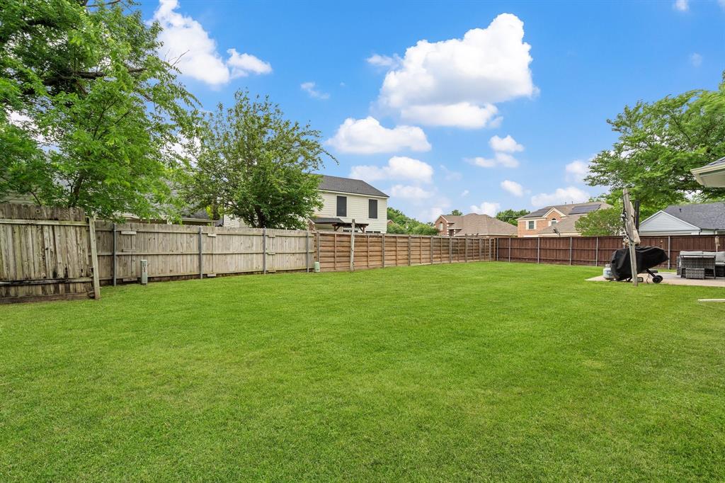 303 Hopewell Street Grand Prairie, TX 75052 - Photo 27 of 28 a view of a backyard with a garden