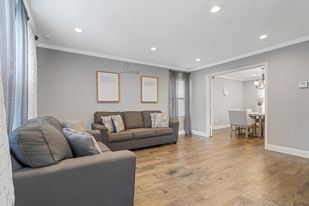 303 Hopewell Street Grand Prairie, TX 75052 - Photo 4 of 28 a living room with furniture and a couch