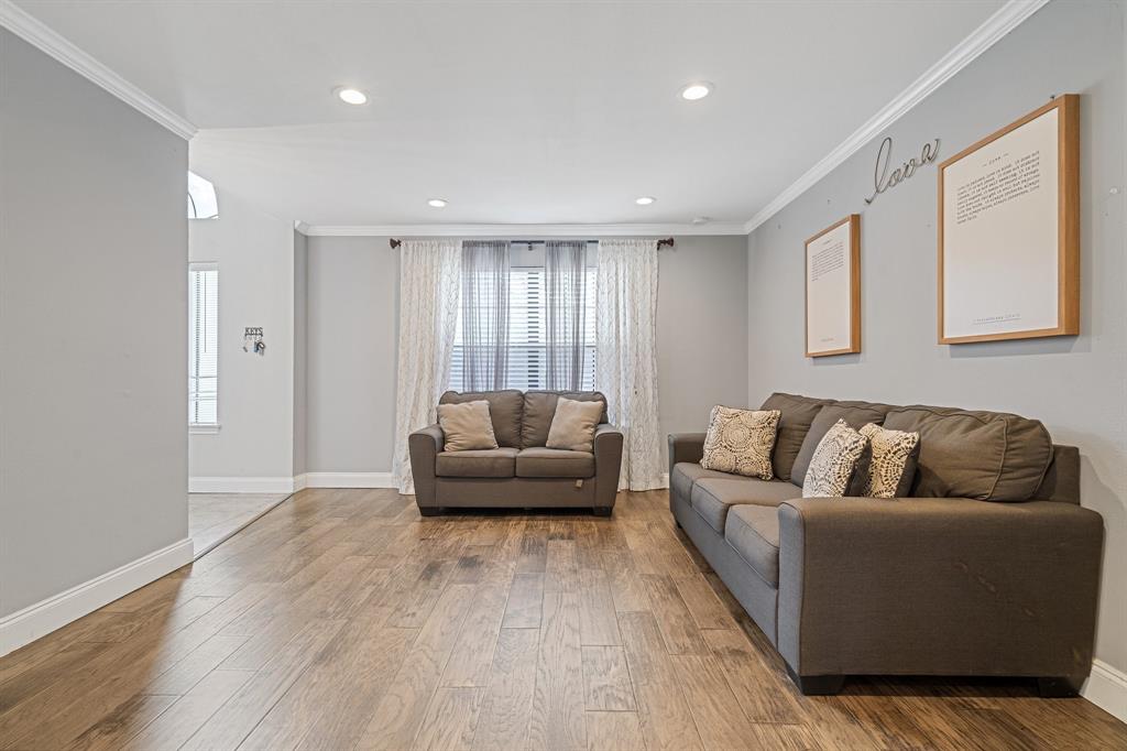 303 Hopewell Street Grand Prairie, TX 75052 - Photo 5 of 28 a living room with furniture and a couch