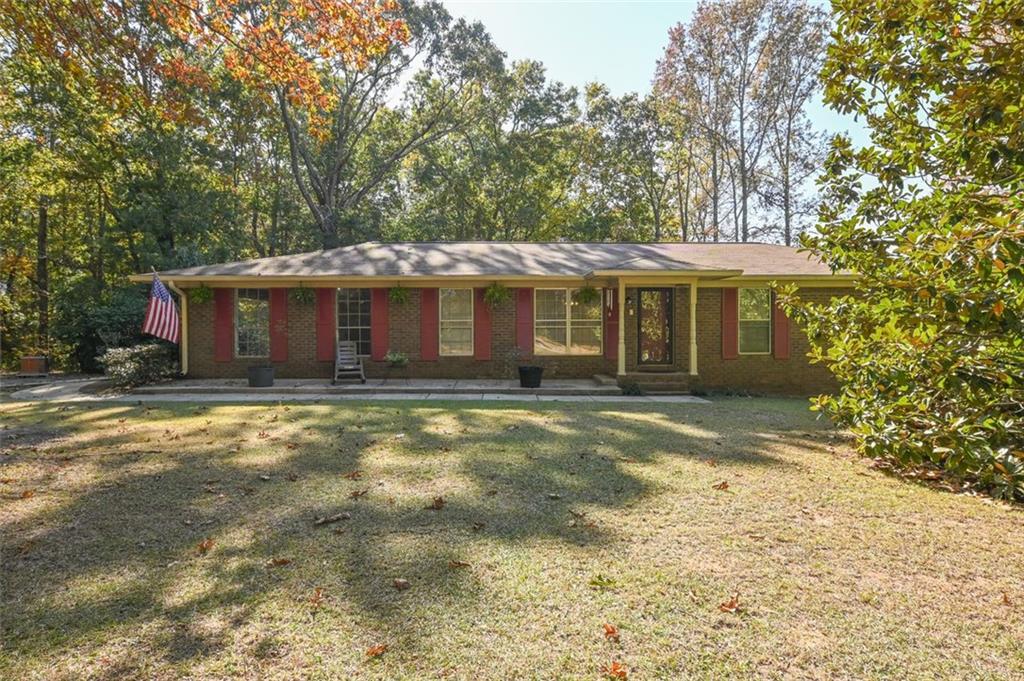 3334 Harmony Church Road Gainesville, GA 30507 - Photo 1 of 1 a front view of a house with a garden