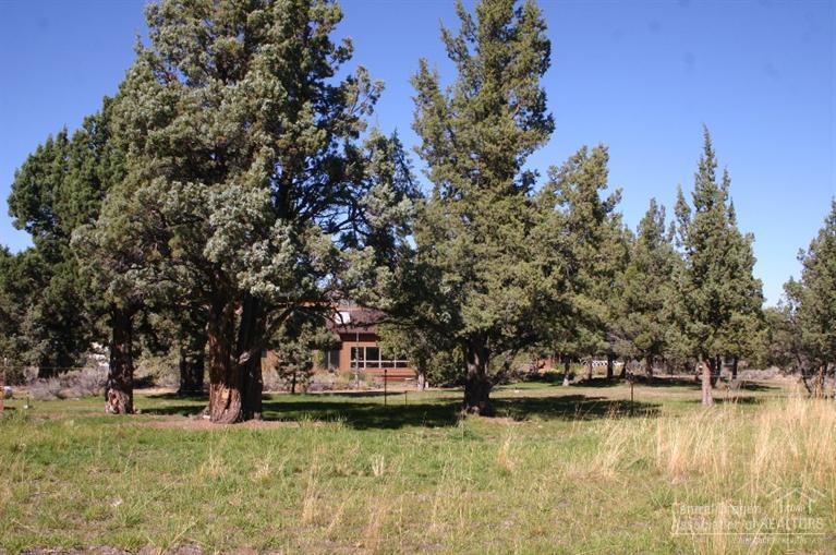 63488 Abbey Road Bend, OR 97701 - Photo 21 of 25 a view of a house with swimming pool and sitting area