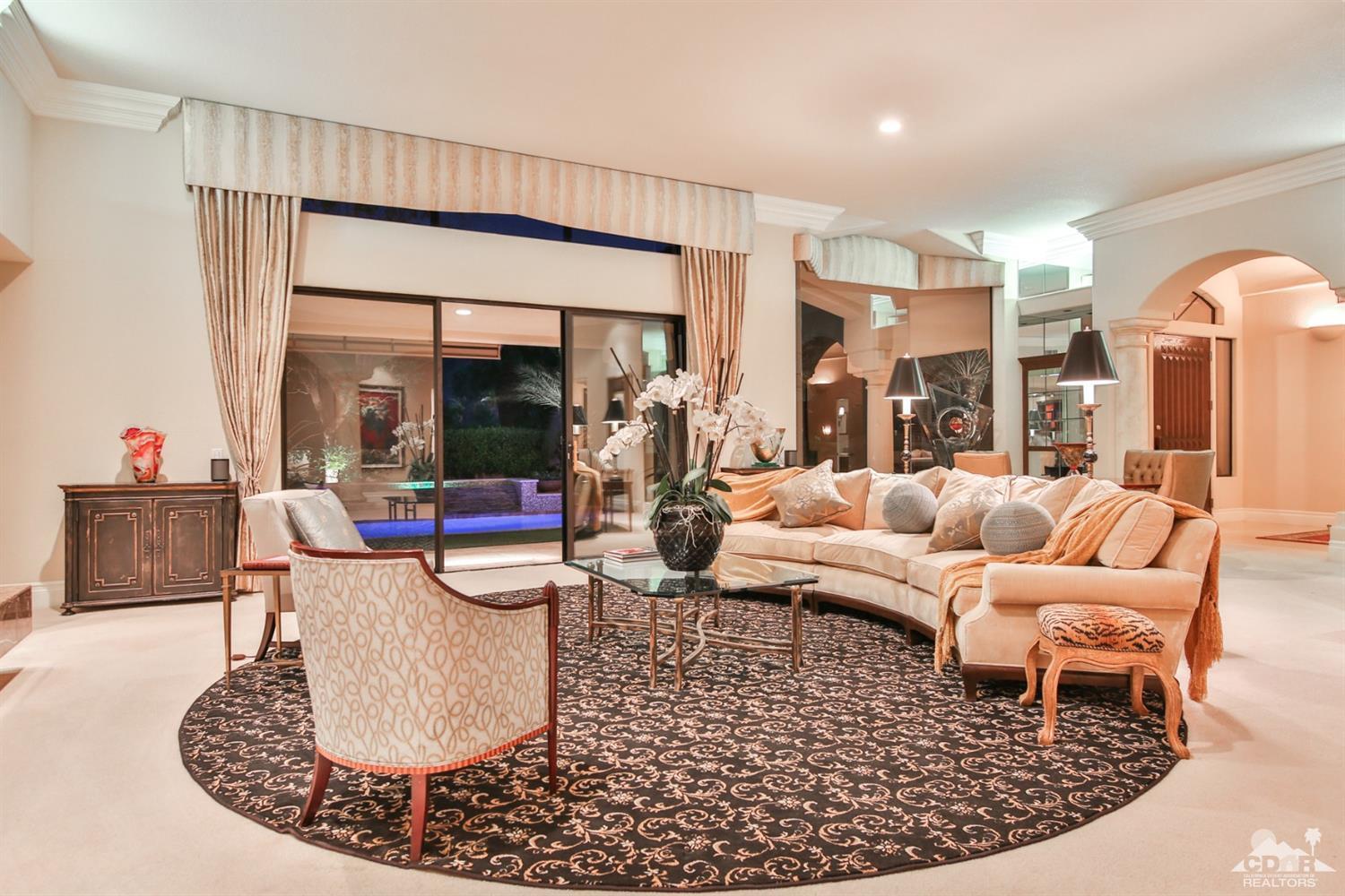 70689 Boothill Road Rancho Mirage, CA 92270 - Photo 15 of 45 a living room with furniture and a large window