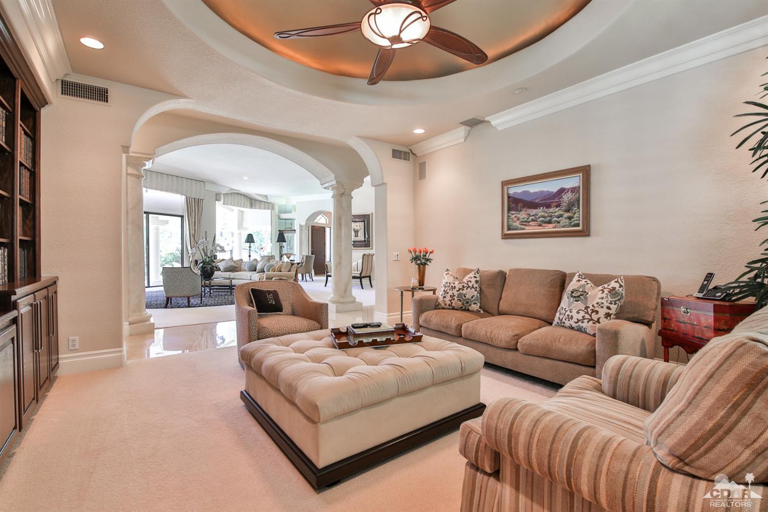 70689 Boothill Road Rancho Mirage, CA 92270 - Photo 16 of 45 a living room with furniture and a chandelier