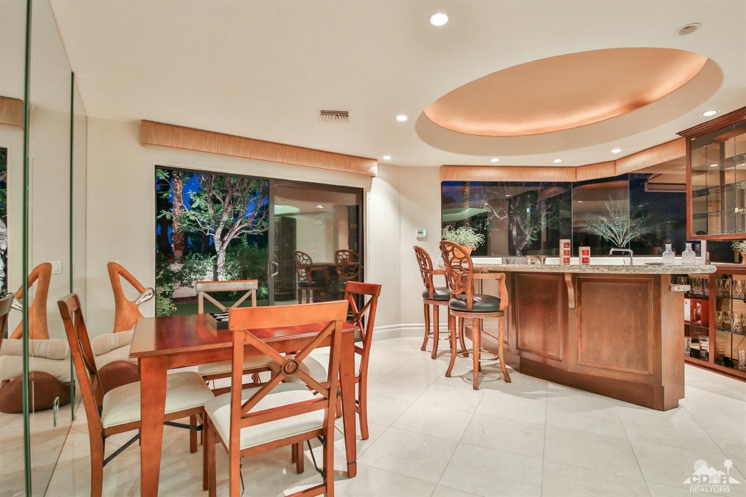70689 Boothill Road Rancho Mirage, CA 92270 - Photo 18 of 45 a view of a dining room with furniture