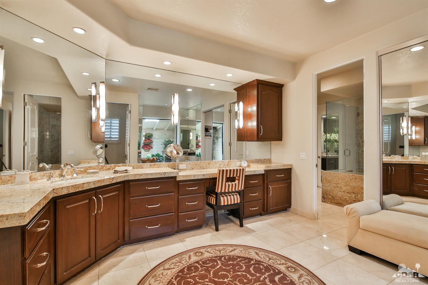 70689 Boothill Road Rancho Mirage, CA 92270 - Photo 23 of 45 a large bathroom with a granite countertop double vanity sink and a mirror