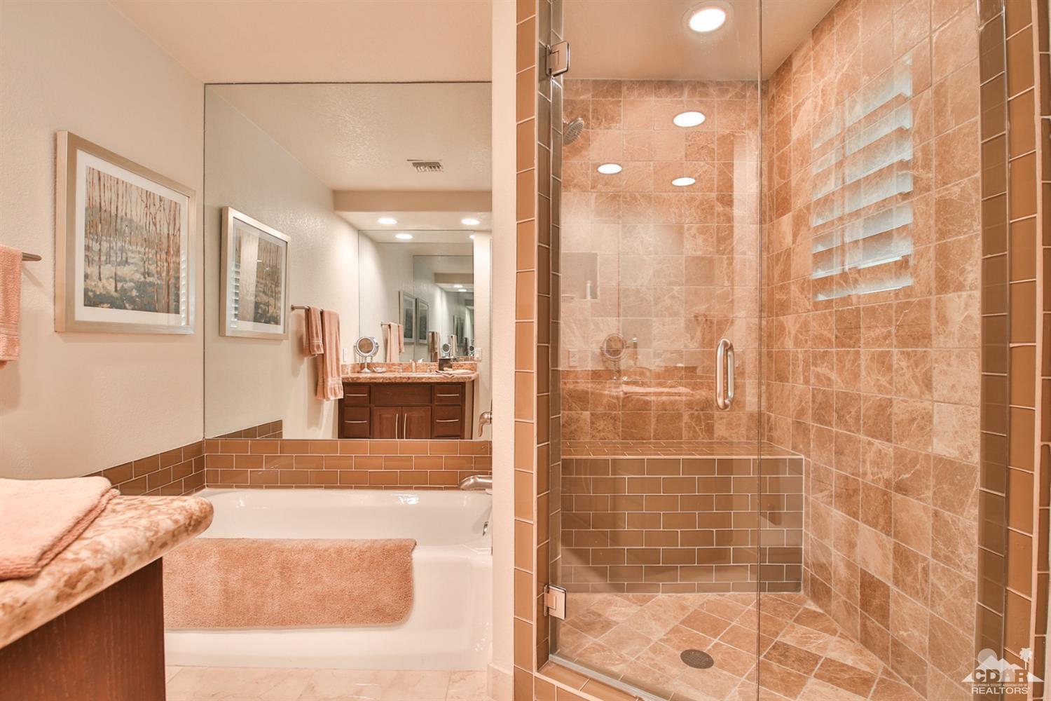 70689 Boothill Road Rancho Mirage, CA 92270 - Photo 26 of 45 a bathroom with a granite countertop sink mirror and shower