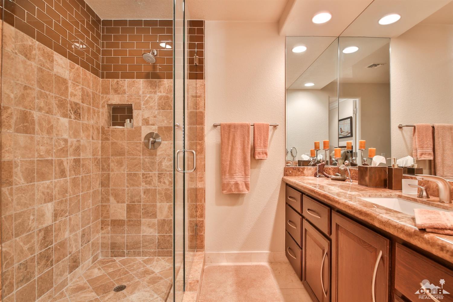70689 Boothill Road Rancho Mirage, CA 92270 - Photo 28 of 45 a bathroom with a shower sink and mirror