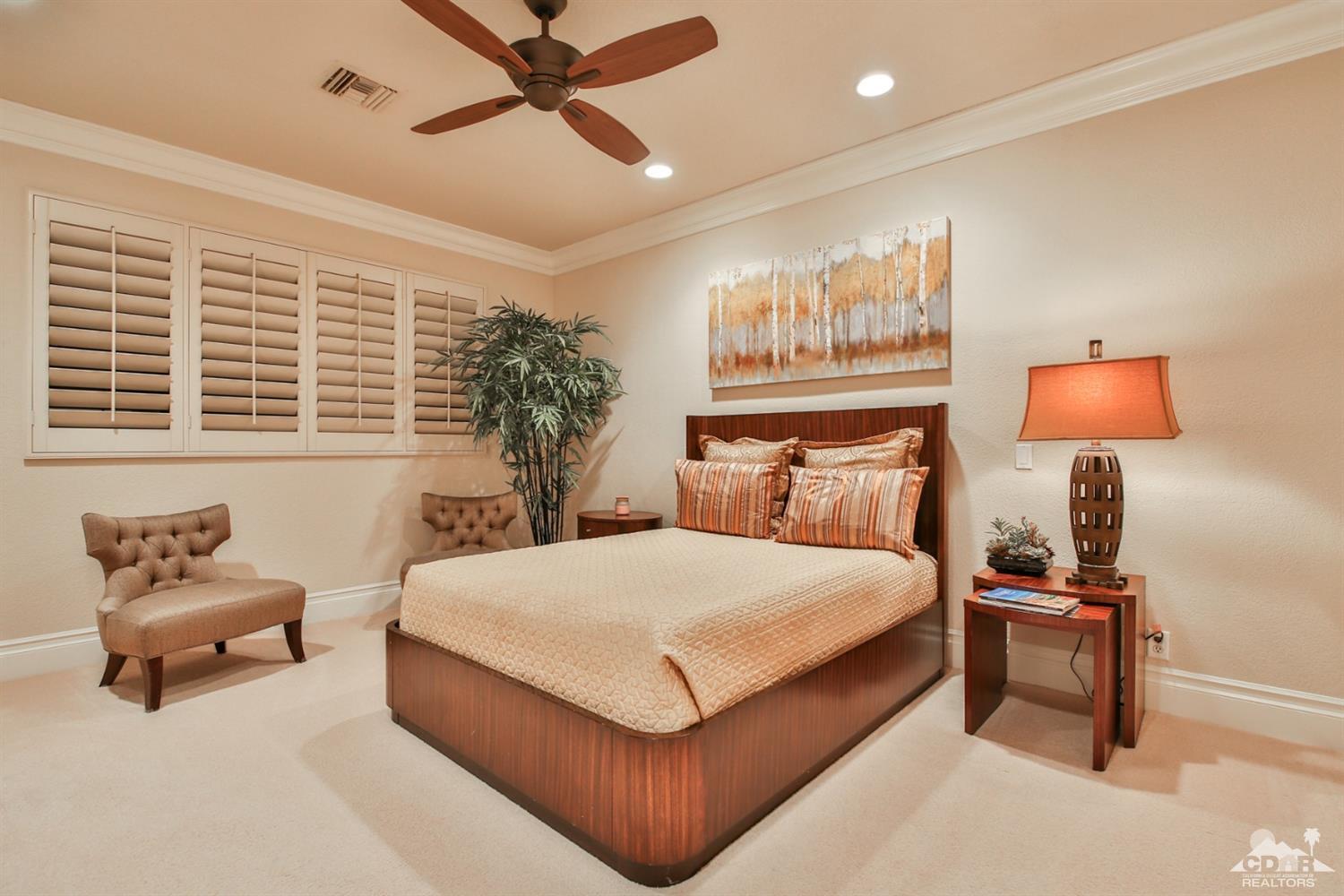 70689 Boothill Road Rancho Mirage, CA 92270 - Photo 29 of 45 a bedroom with a bed and chair