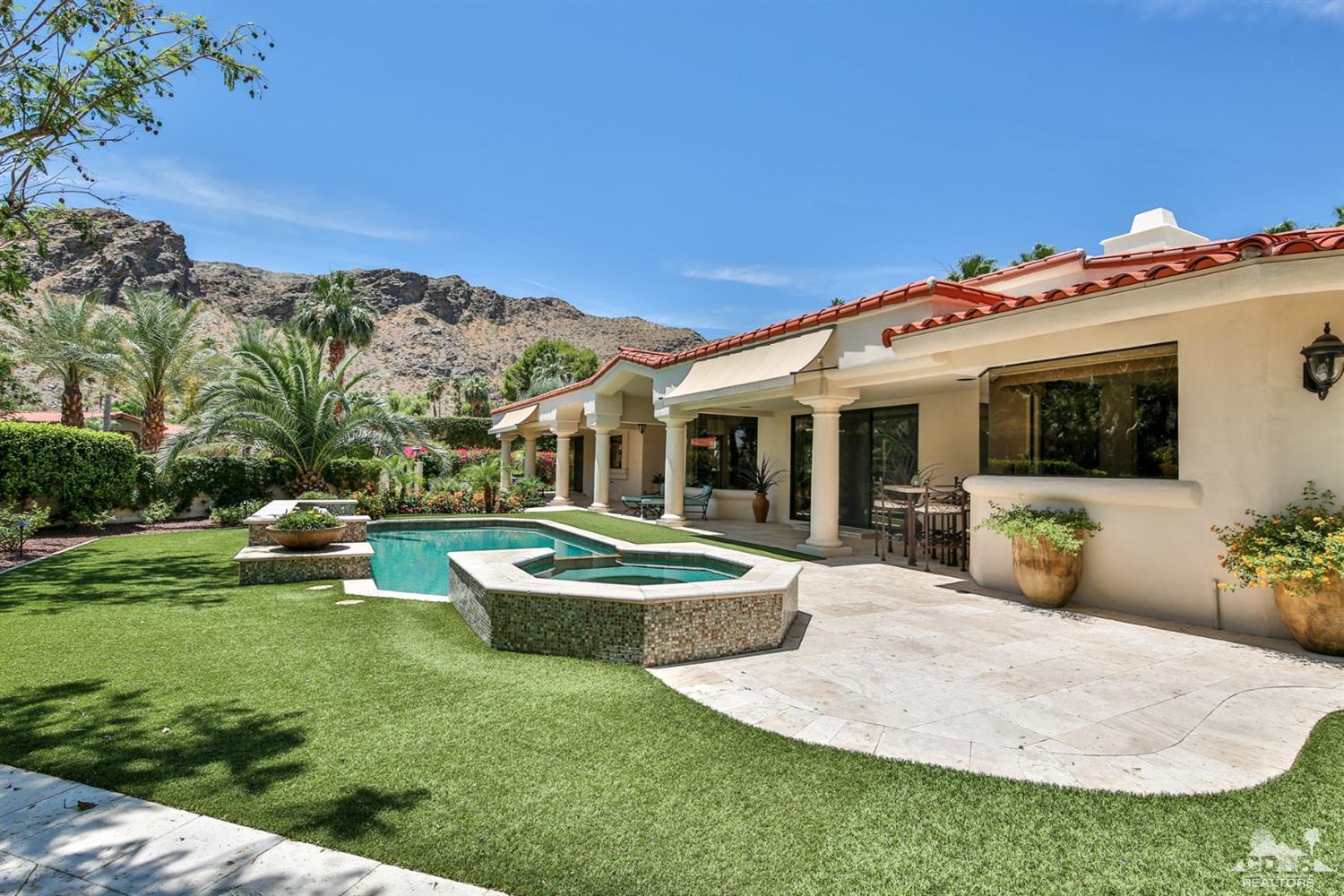 70689 Boothill Road Rancho Mirage, CA 92270 - Photo 33 of 45 a front view of a house with garden and porch