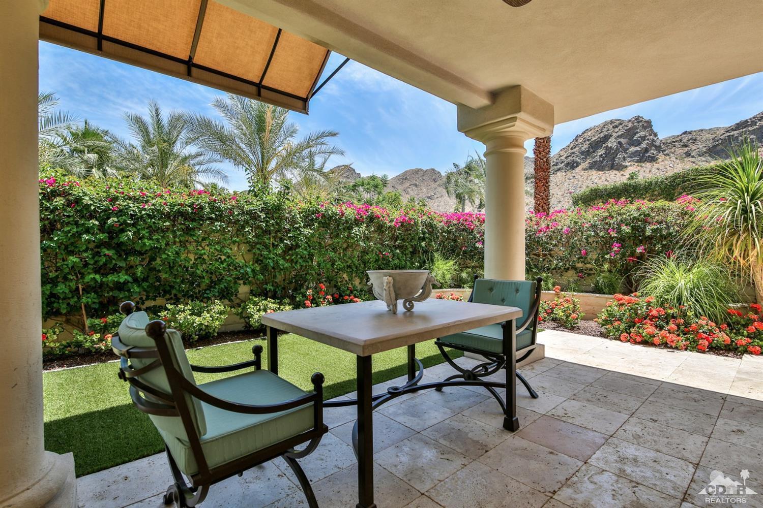 70689 Boothill Road Rancho Mirage, CA 92270 - Photo 35 of 45 a table and chairs in front of a building