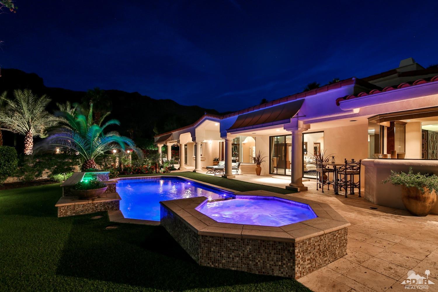 70689 Boothill Road Rancho Mirage, CA 92270 - Photo 40 of 45 a view of a patio with table and chairs potted plants and palm tree