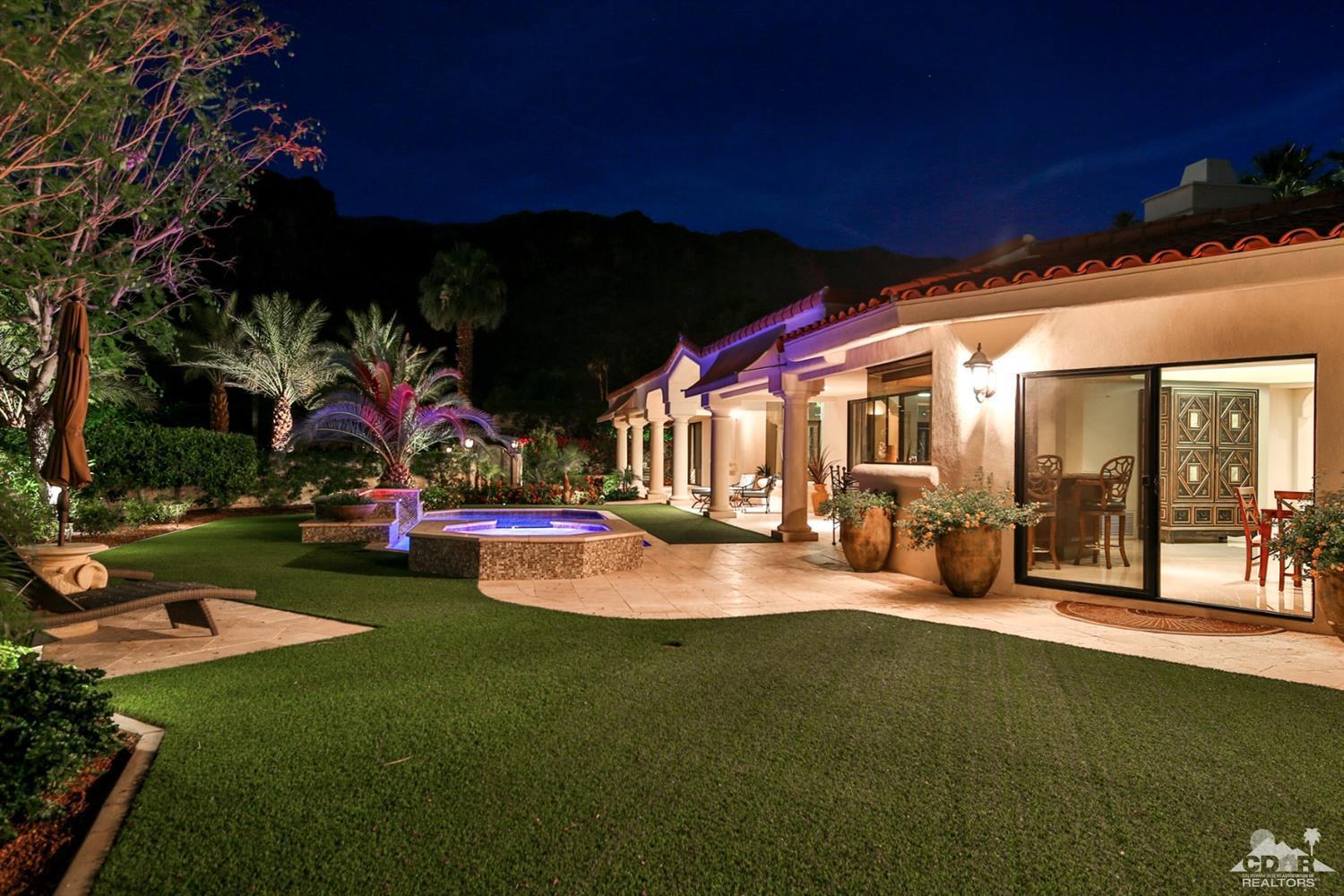 70689 Boothill Road Rancho Mirage, CA 92270 - Photo 43 of 45 a view of a patio with table and chairs and potted plants