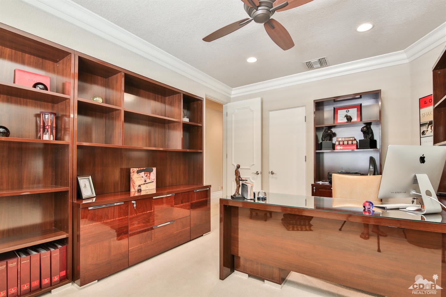 70689 Boothill Road Rancho Mirage, CA 92270 - Photo 8 of 45 a living room with couches bookshelf and a dining table with wooden floor