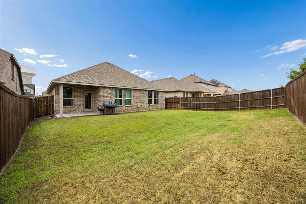 638 Hazeltine Road Red Oak, TX 75154 - Photo 23 of 29 a front view of a house with a yard