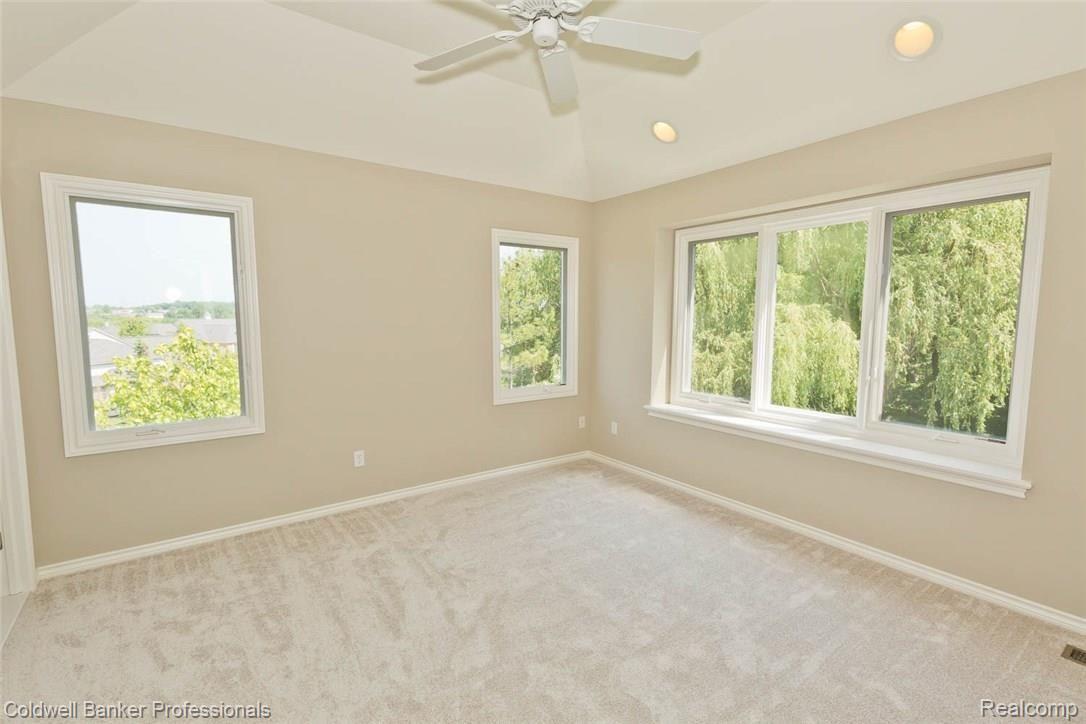 5329 Keswick Court Rochester, MI 48306 - Photo 29 of 64 Bedroom 1 featuring tray ceiling.