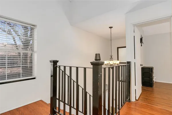 a view of hallway with windows
