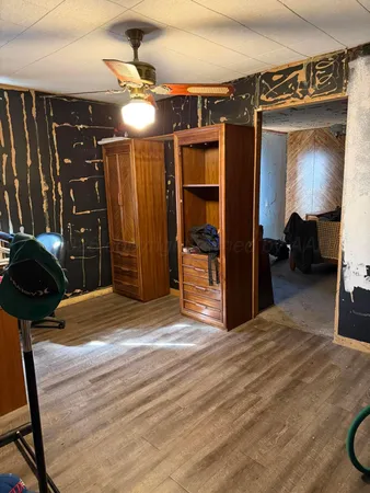 a bedroom with a bed and a closet