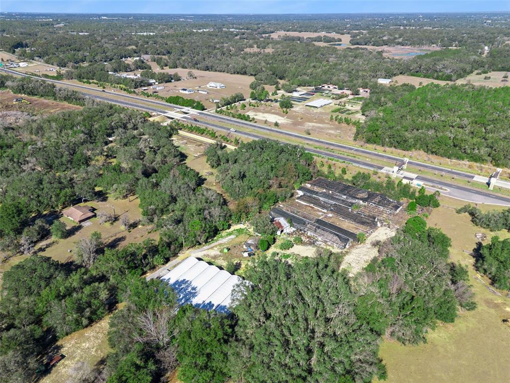 1909 Haas Road Apopka, FL 32712 - Photo 12 of 13 an aerial view of a city with mountains