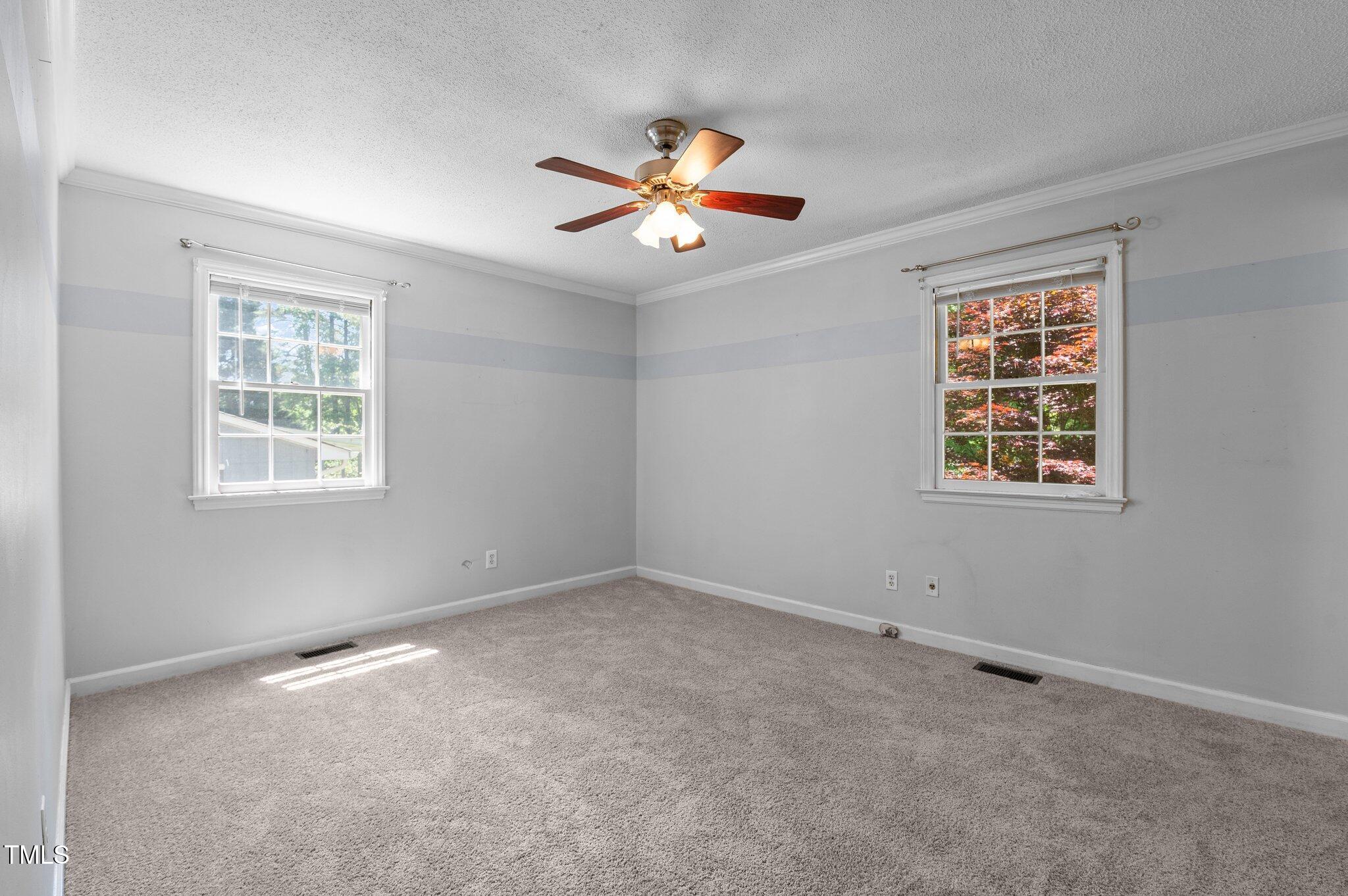 612 Harvest Lane Raleigh, NC 27606 - Photo 17 of 38 a view of an empty room with a window