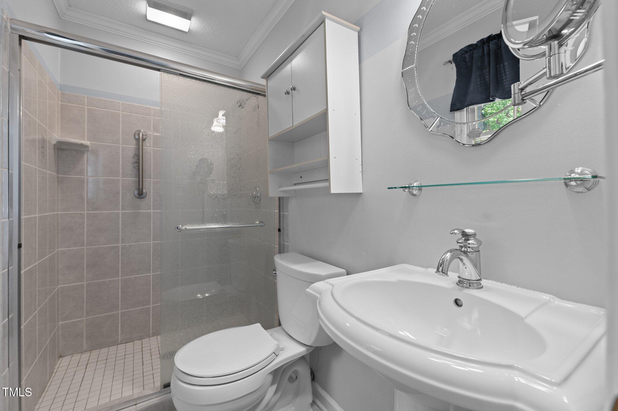 612 Harvest Lane Raleigh, NC 27606 - Photo 19 of 38 a bathroom with a sink toilet and shower