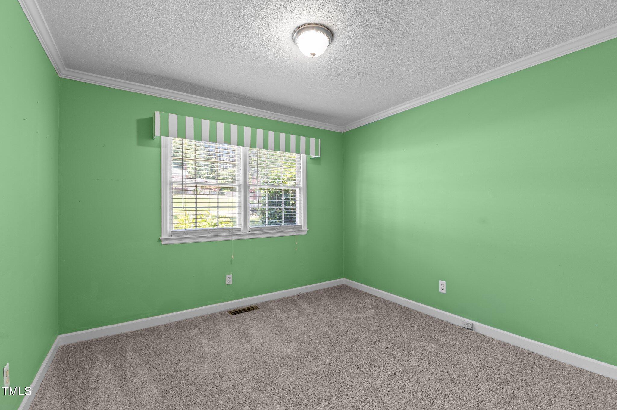 612 Harvest Lane Raleigh, NC 27606 - Photo 20 of 38 a view of an empty room with a window