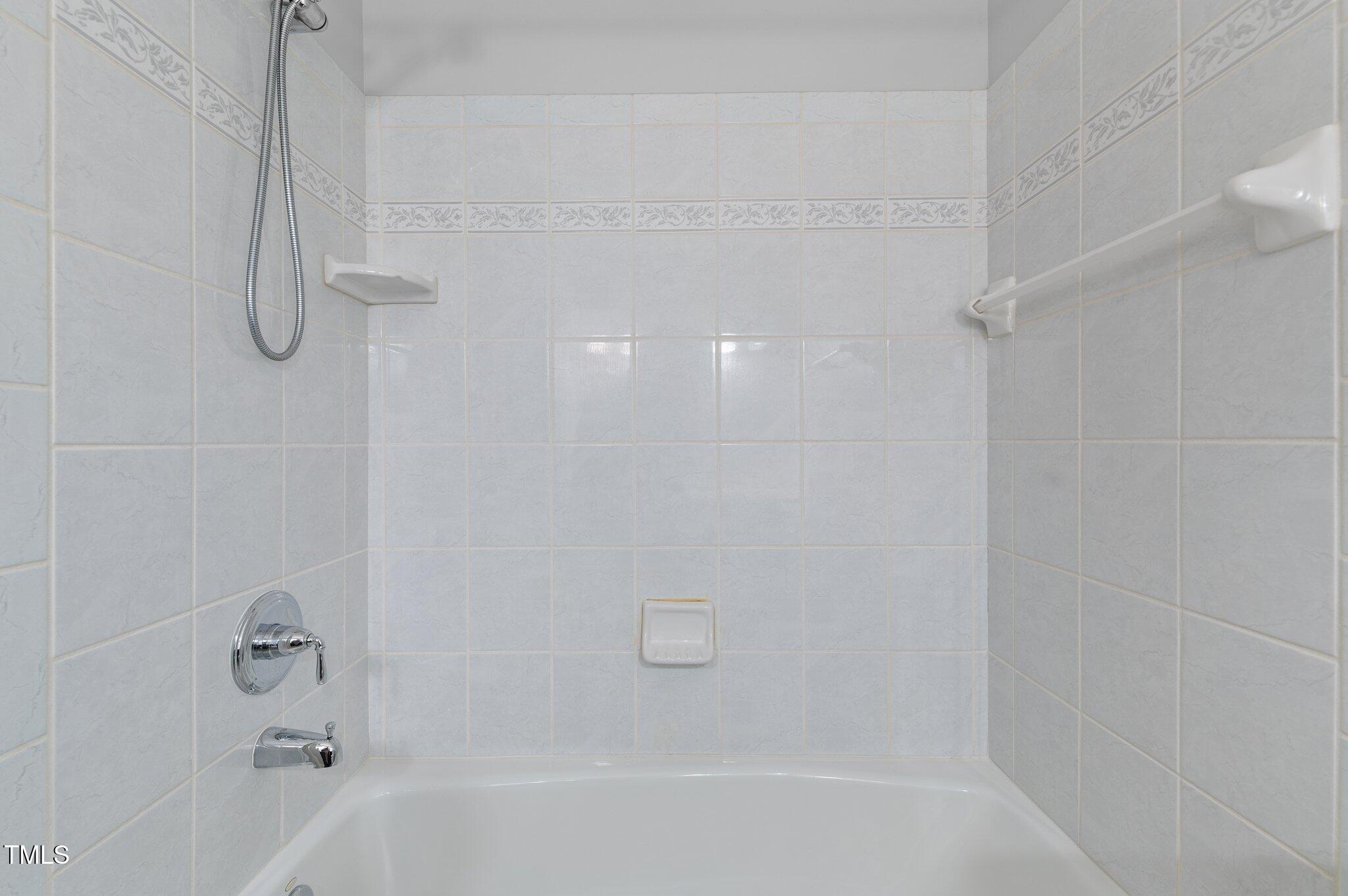 612 Harvest Lane Raleigh, NC 27606 - Photo 23 of 38 a bathroom with a bathtub