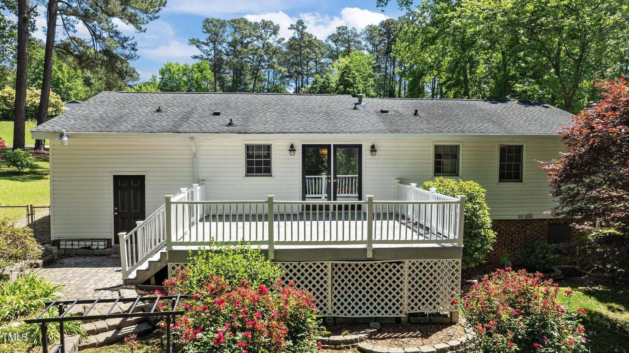 612 Harvest Lane Raleigh, NC 27606 - Photo 28 of 38 a front view of a house with a garden