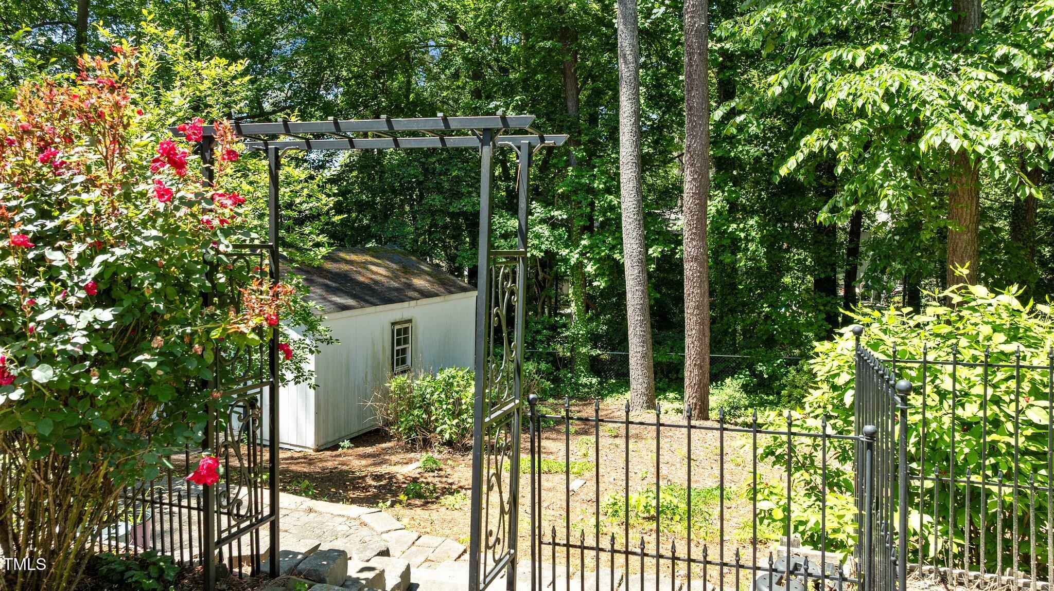 612 Harvest Lane Raleigh, NC 27606 - Photo 30 of 38 a view of a house with fountain in front of it