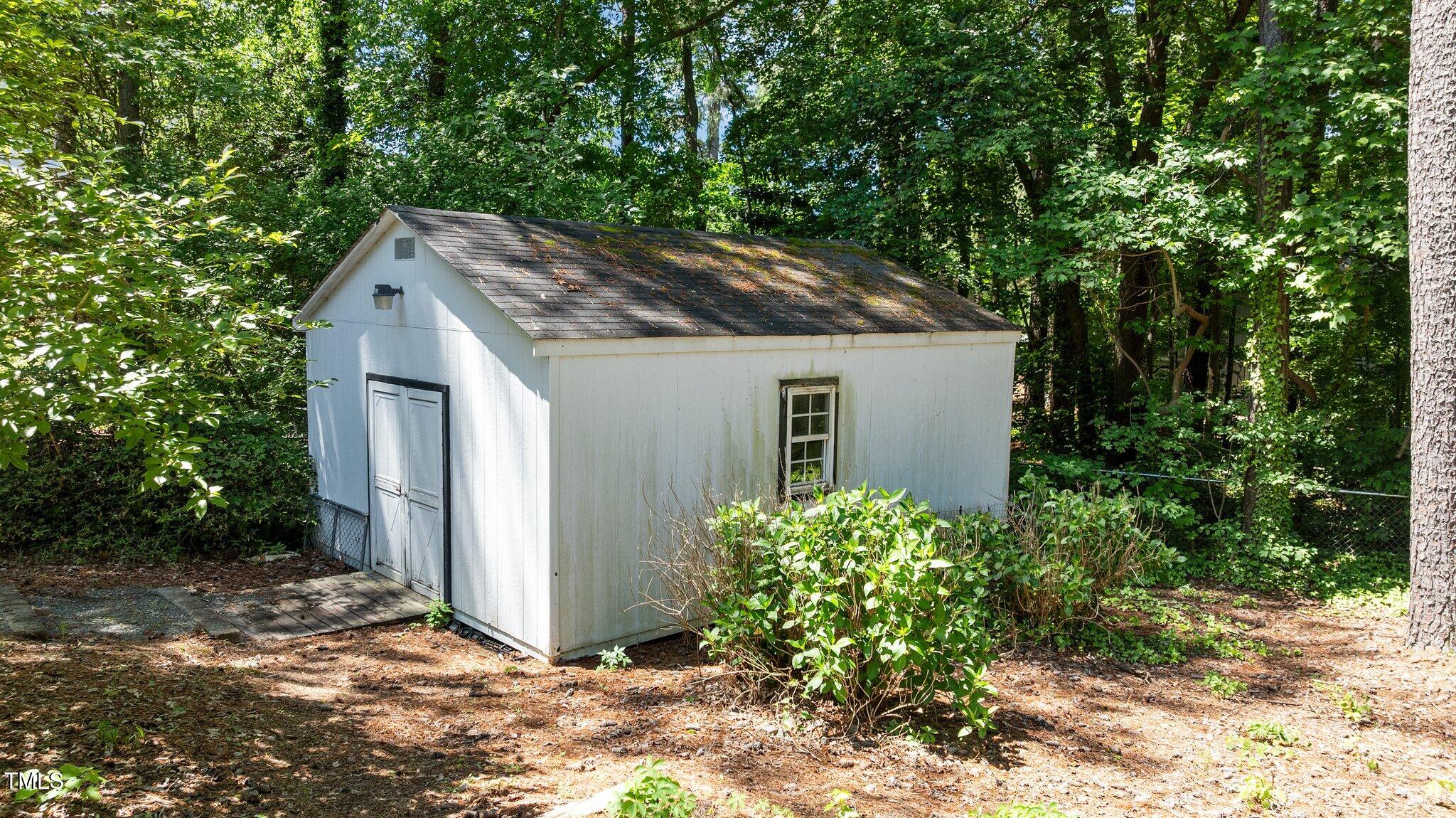 612 Harvest Lane Raleigh, NC 27606 - Photo 32 of 38 a house with lots of trees