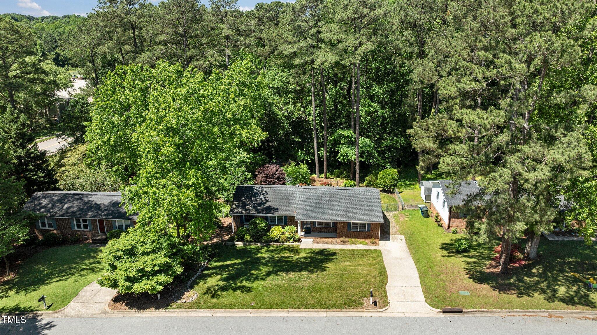 612 Harvest Lane Raleigh, NC 27606 - Photo 34 of 38 a view of a backyard with sitting area