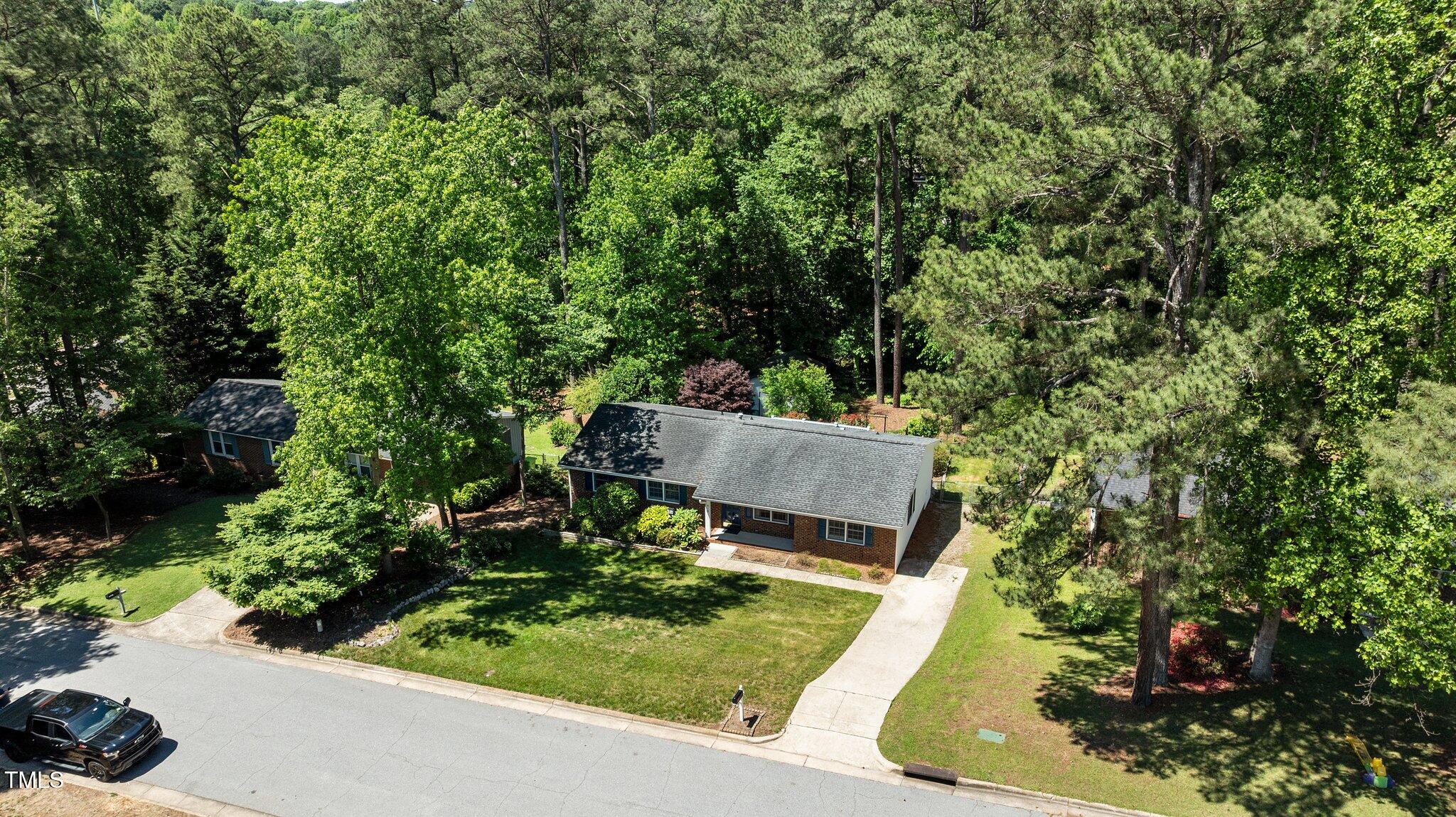 612 Harvest Lane Raleigh, NC 27606 - Photo 36 of 38 a view of a garden with sitting area