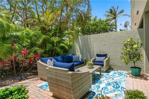 a view of outdoor sitting area with fire pit