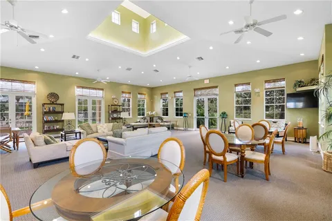 a living room with fireplace furniture and a table