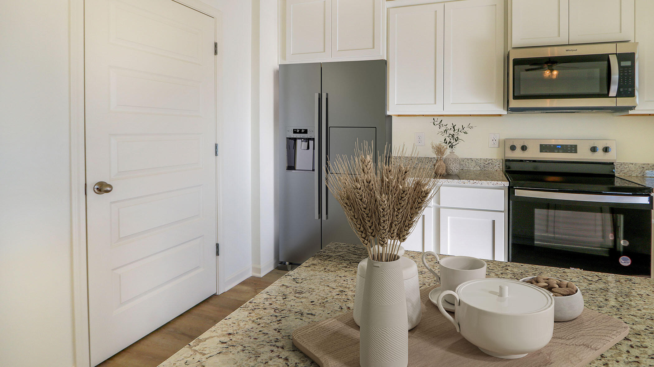 140 Dockside Road Freeport, FL 32439 - Photo 3 of 21 a kitchen with stainless steel appliances a stove a sink and a refrigerator