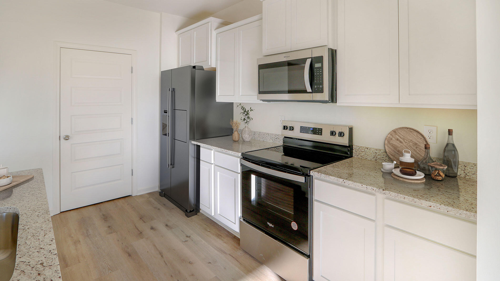 140 Dockside Road Freeport, FL 32439 - Photo 8 of 21 a kitchen with stainless steel appliances a stove microwave and refrigerator