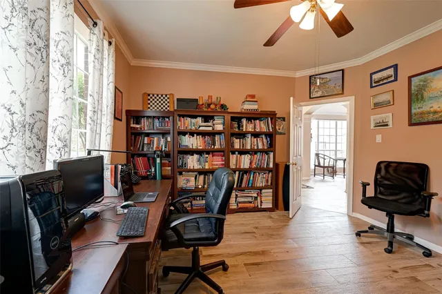 a view of a livingroom with furniture and a window