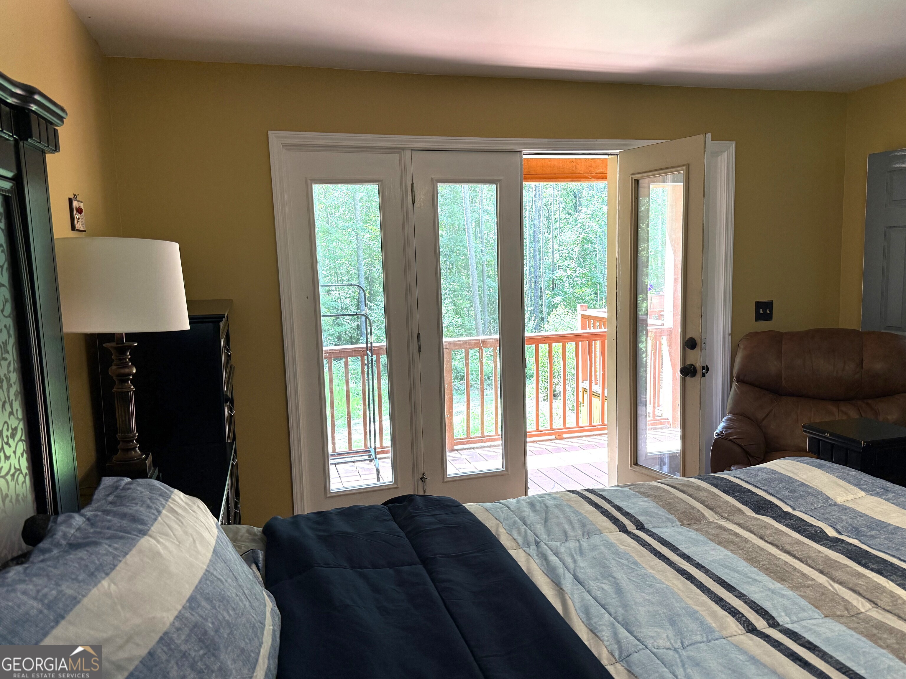 725 Musgrove Road Griffin, GA 30223 - Photo 25 of 52 a bedroom with a bed and a large window