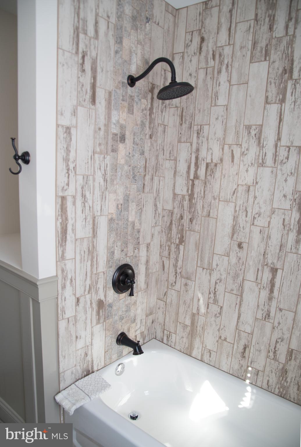 4130 Fairfax Road Baltimore, MD 21216 - Photo 14 of 30 a bathroom with a sink and a shower