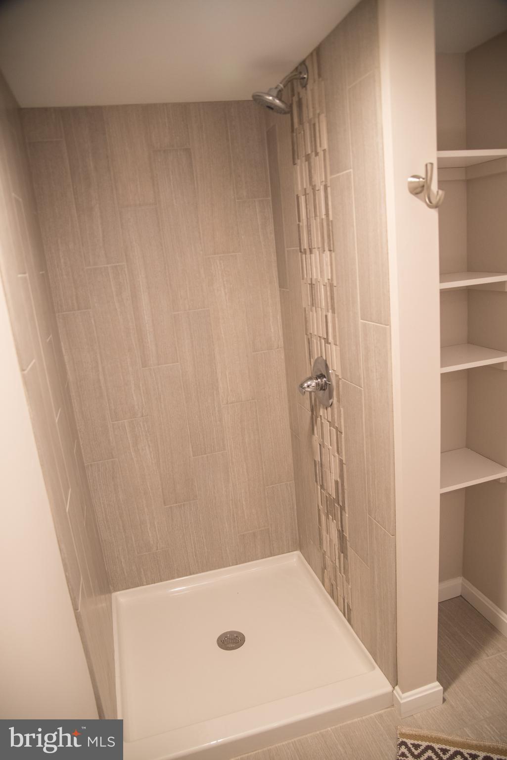 4130 Fairfax Road Baltimore, MD 21216 - Photo 29 of 30 a bathroom with a tub and shower