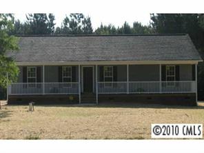 a view of a house with a large window
