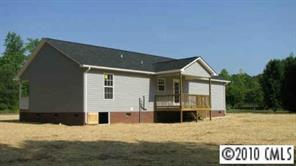 2118 Cedar Road York, SC 29745 - Photo 5 of 8 a front view of a house with a yard