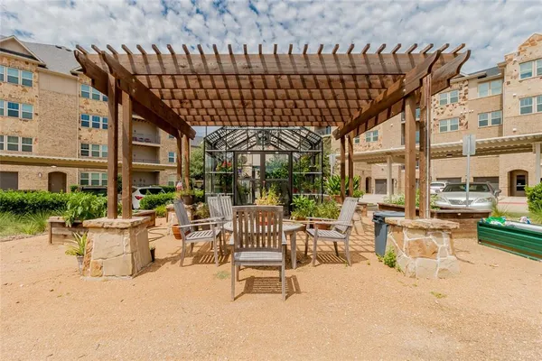 a view of a couches and dinning table in patio